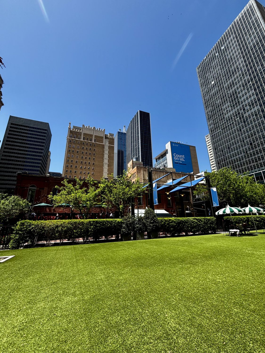 Glass office towers over a downtown plaza